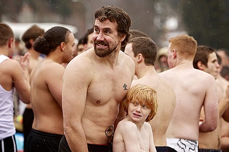 &lt;p&gt;Tyson West and his son Niam West, 9, wait for the start of the 33rd annual Polar Bear Plunge at Sanders Beach.&lt;/p&gt;