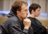 Michael Christensen, coach of the Speech and Debate team at Columbia Falls High School looks on a member of the team practice on Monday. In the background is team member Nathan Trinastich, a junior.