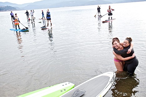 &lt;p&gt;Cassie Loeffler, left, clings to her cousin Brooke Clark after she stripped to her underwear to make a commiserating plunge after Clark fell off her paddle board and into the water while serving as a lifeguard for the Polar Bear Plunge. &quot;I wasn't planning on going,&quot; Loeffler said. &quot;But I felt bad that she fell in so I figured I couldn't let her be cold by herself.&quot;&lt;/p&gt;