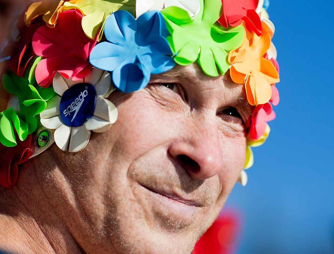 &lt;p&gt;Carl Knight sports a flowery swim cap as he waits for the start of the annual Polar Bear Plunge on Friday at Sanders Beach in Coeur d'Alene.&lt;/p&gt;