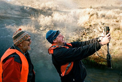 &lt;p&gt;Ken Sims strains to see the screen on a piece of equipment as Ron Frost looks on at Boiling Water near Gardner last November.&lt;/p&gt;