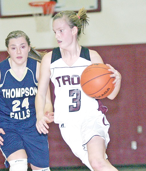 &lt;p&gt;Junior Jordan Williams drives past T-Falls' Logan Beckman to
score in first quarter.&lt;/p&gt;