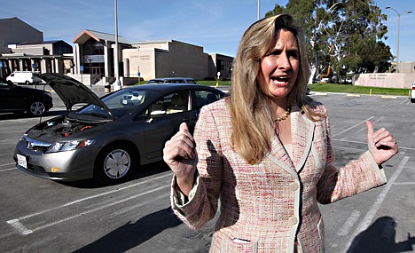 &lt;p&gt;Heather Peters, who says her 2006 Honda Civic Hybrid, rear, never achieved the 50 mpg Honda claimed in its advertising, talks with reporters outside small claims court in Torrrance, Calif., Tuesday, Jan. 3, 2012. Peters has opted out of a class action settlement agreed to by Honda because it does not provide enough remuneration. (AP Photo/Reed Saxon)&lt;/p&gt;