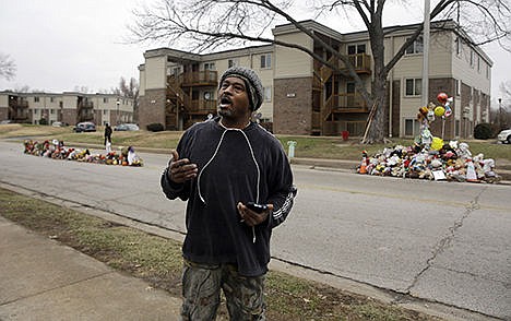 &lt;p&gt;Ken &quot;Kennyboy&quot; Boyd speaks to a reporter on Dec. 8, at the spot where Michael Brown's body lay for four hours in the August sun in Ferguson, Mo. Before this summer, few outside St. Louis County knew that Ferguson existed. That changed on Aug. 9, when white police officer Darren Wilson fatally shot Michael Brown, an unarmed black teenager.&lt;/p&gt;