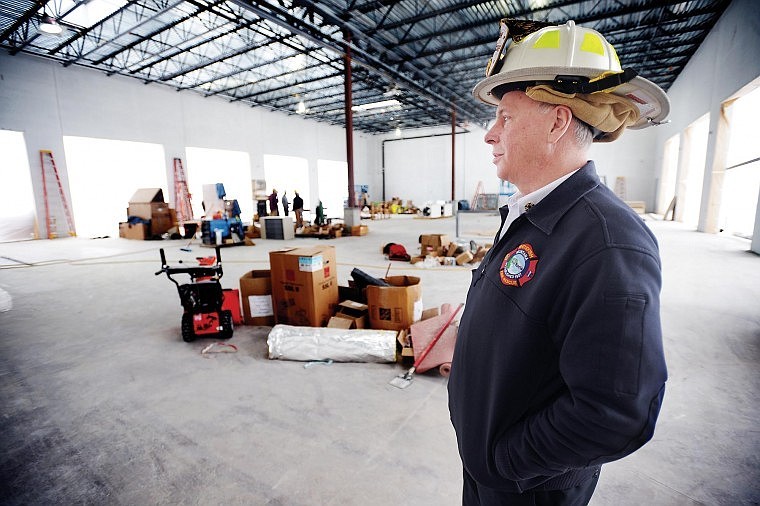 Kennelly looks over the Emergency Services Center under construction in Whitefish.