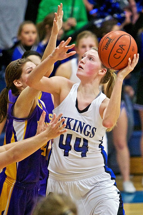 <p>JEROME A. POLLOS/Press Coeur d'Alene High's Sydney Williams goes up for a shot against a Lewiston High defender in the second half.</p>