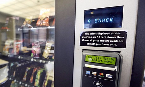 &lt;p&gt;A vending machine advertises snacks on a small screen on the machine in Seattle on Dec. 23, 2013.&lt;/p&gt;