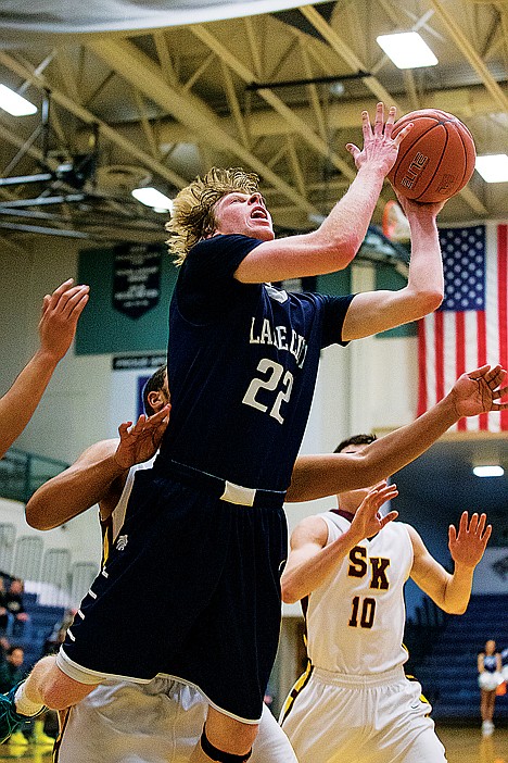 <p>Kyle Guice, of Lake City, puts up a score after being fouled in the third quarter.</p>