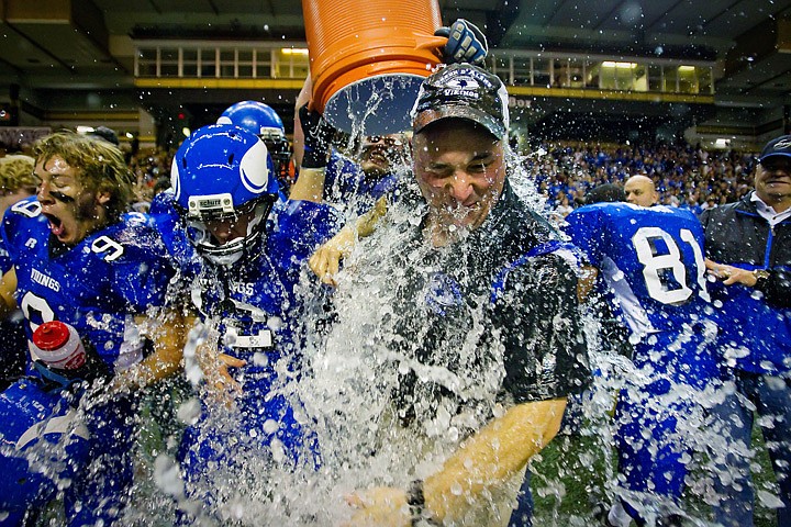 &lt;p&gt;JEROME A. POLLOS/Press Coeur d'Alene High head coach Shawn Amos receives a celebratory drenching from his players during the closing seconds of the Viking's 28-7 win over Centennial High in the 5A State Championship Friday, Nov. 19 at the University of Idaho Kibbie Dome. The state title is the first for the Vikings in 25 years.&lt;/p&gt;