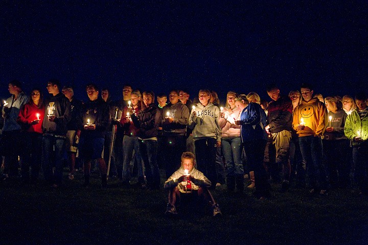 &lt;p&gt;JEROME A. POLLOS/Press Classmates, friends and family gather on a grassy hillside between the Coeur d'Alene High School baseball and football fields Monday, Sept. 13 to remember Devon Austin and Ryan Reinhardt who were killed in a car wreck early Sunday near Twin Falls.&lt;/p&gt;