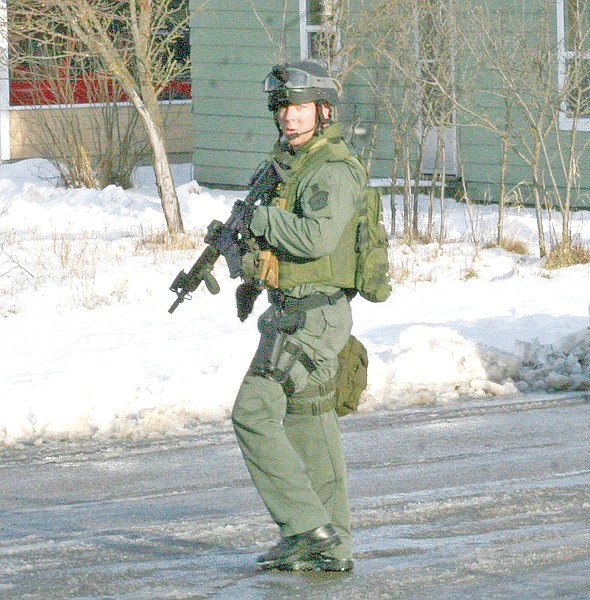 &lt;p&gt;An SRT member stood sentry on the street as the events of the
day unfolded.&lt;/p&gt;