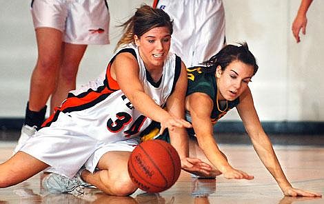 Flathead&#146;s Ashley Brown (34) and Whitefish&#146;s McCara Cullen battle for a loose ball during second-quarter action at Flathead on Friday night.Garrett Cheen/Daily Inter Lake