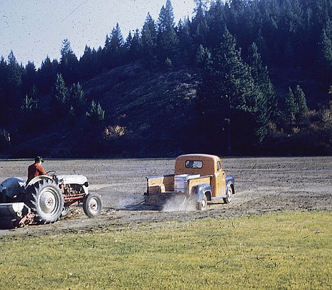 &lt;p&gt;A truck and a tractor seed the fields during the late 1950s.&lt;/p&gt;