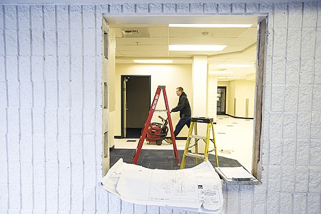 &lt;p&gt;Gabe Bujko of Ginno Construction wheels a vacuum through the front office area of Coeur d'Alene High School on Friday. The high school is in the final stage of a remodel of its administrative offices to make the entryway more visible. Schools throughout Coeur d&Otilde;Alene are making improvements to boost security.&lt;/p&gt;