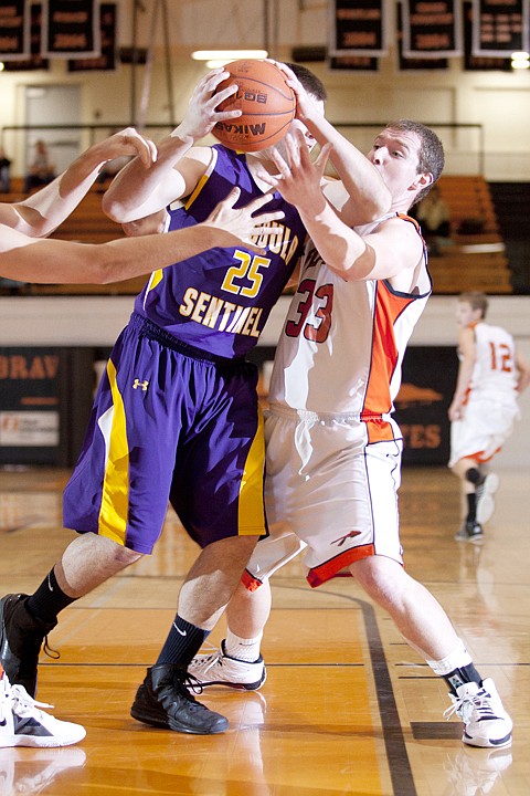 &lt;p&gt;Flathead&#146;s Austin Jones (33) reaches in on Missoula Sentinel&#146;s
Nathan Jewett (25).&lt;/p&gt;