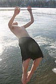 Nate Quinton ups the ante with a backflip into the river at last Saturday's Polar Plunge.