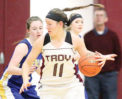 <p>Sophomore Allie Coldwell drives on Gillian Nelson in first quarter vs. Thompson Falls Jan. 2, 2016. (54-41, Troy)</p>