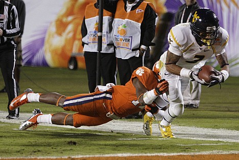 &lt;p&gt;West Virginia wide receiver Stedman Bailey (3) runs for a touchdown as Clemson cornerback Bashaud Breeland (17) makes the tackle during the second half of the Orange Bowl NCAA college football game Wednesday, Jan. 4, 2012, in Miami. (AP Photo/Lynne Sladky)&lt;/p&gt;