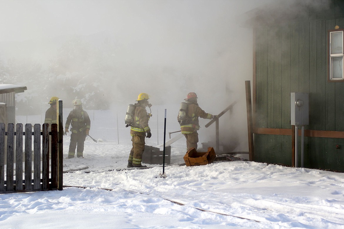 &lt;p&gt;Firefighters from the Plains-Paradise Rural Fire Department prepare to enter a burning residence.&lt;/p&gt;