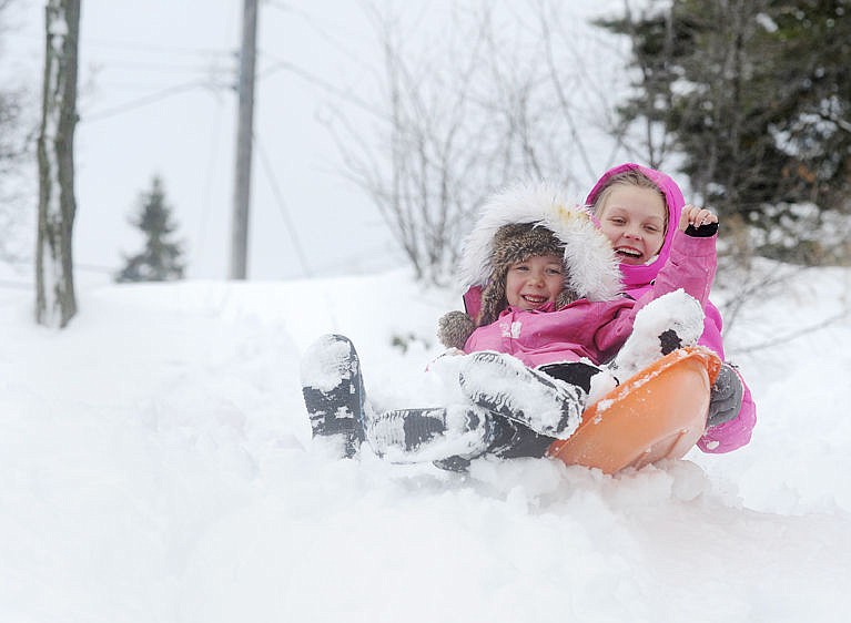 &lt;p&gt;Brooklyn, left, and Lucy Ek help each other make a snowman in Somers on Tuesday. Snow depths of nearly 2 feet from a storm Sunday and Monday allowed for plenty of winter fun.&#160;&lt;/p&gt;