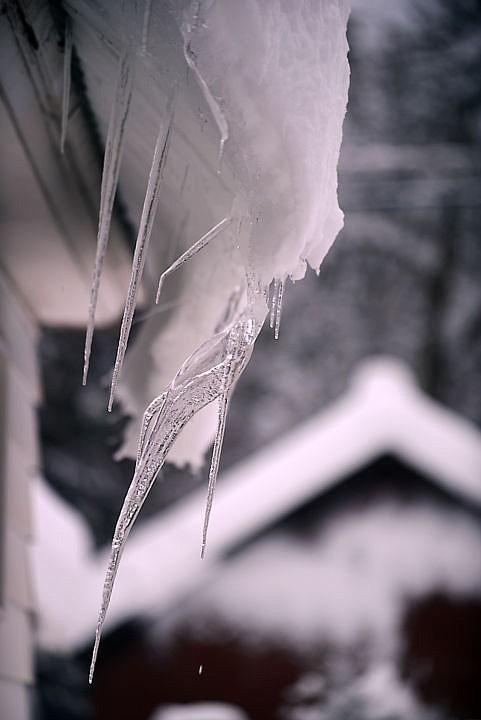 <p><strong>Icicles grow</strong> at changing angles as the snow on this Whitefish roof curls around a rain gutter. (Brenda Ahearn/Daily Inter Lake)</p>