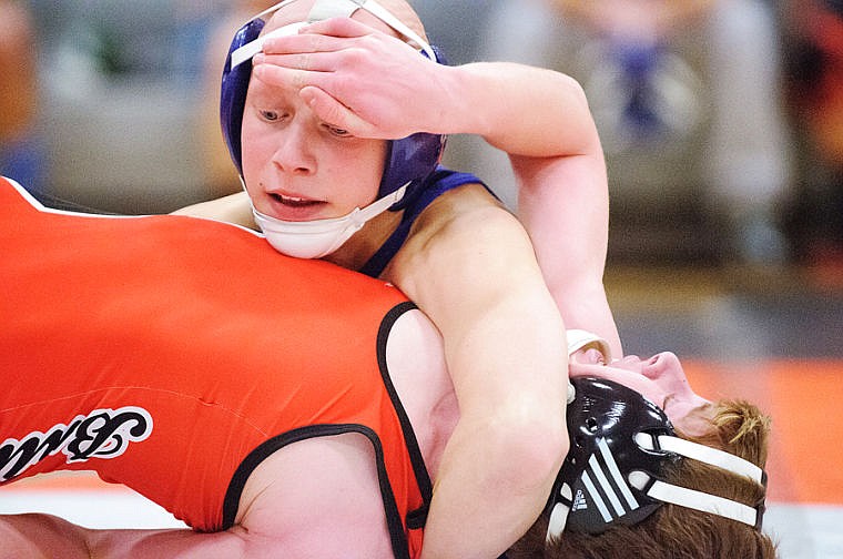 &lt;p&gt;Columbia Falls 113-pound wrestler Mason Fetters (top) tries to pin Sandpoint's Scout Nash Thursday night during the wrestling match a Flathead High School. Jan. 2, 2014 in Kalispell, Montana. (Patrick Cote/Daily Inter Lake)&lt;/p&gt;