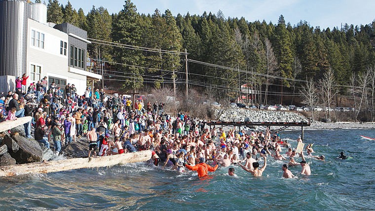 &lt;p&gt;Participants race into the cold waters of Flathead Lake on Wednesday afternoon during the annual Polar Bear Plunge at The Raven in Woods Bay.. Jan. 1, 2014 in Woods Bay, Montana. (Patrick Cote/Daily Inter Lake)&lt;/p&gt;