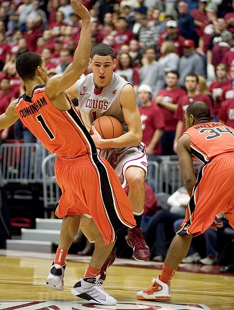 &lt;p&gt;Washington State guard Klay Thompson, center, drives into Oregon State Guard Jared Cunningham (1) during the first half Thursday in Pullman. No foul was called on the play.&lt;/p&gt;