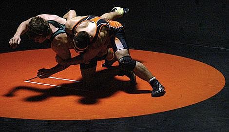 Whitefish&#146;s Tim Lehner, left, tries to escape from the grasp of Flathead&#146;s Levi Holt during the 171-pound match at Flathead High School. Lehner defeated Holt 4-2 during Friday night&#146;s dual. The Braves topped the Bulldogs, 58-15. Craig Moore/Daily Inter Lake