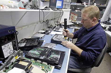 &lt;p&gt;Technician Shawn Cable repairs a video game console at the Laptops Plus computer store in Winter Park, Fla., Thursday, Jan. 5, 2012. A burst of hiring in December pushed the unemployment rate to its lowest level in nearly three years, giving the economy a boost at the end of 2011. (AP Photo/John Raoux)&lt;/p&gt;