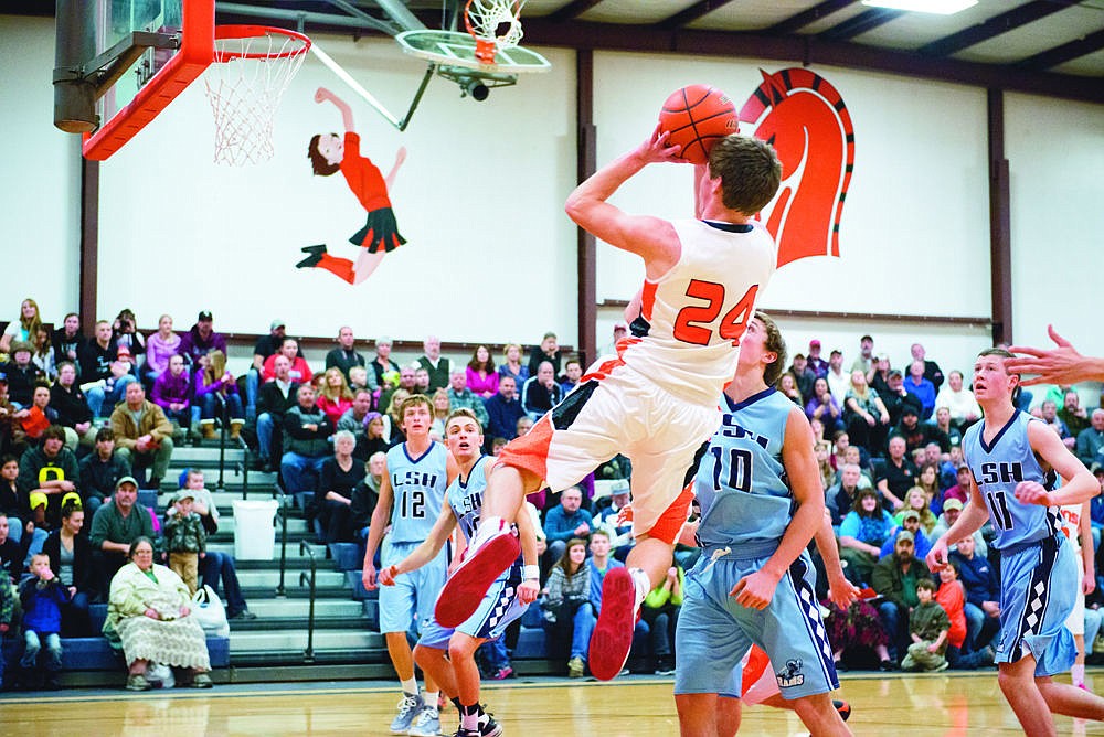 &lt;p&gt;Kyle Revier shoots a fade away against the Loyola Sacred Heart Rams Friday night.&lt;/p&gt;