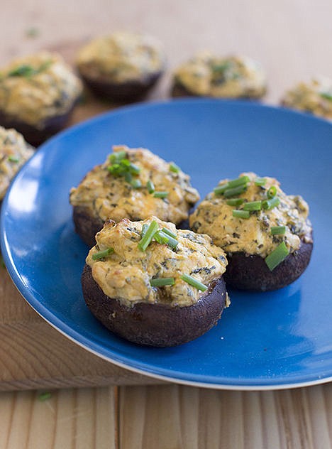 <p>This dish takes the flavors of a Buffalo wing and stuffs them into a mushroom cap and then is baked making for a great healthy tailgating snack. </p>