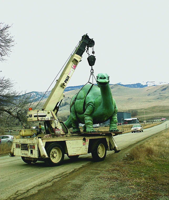 &lt;p&gt;Volunteers help to relocate the 2,000 pound Brontosaurus from Piccadilly Park.&lt;/p&gt;