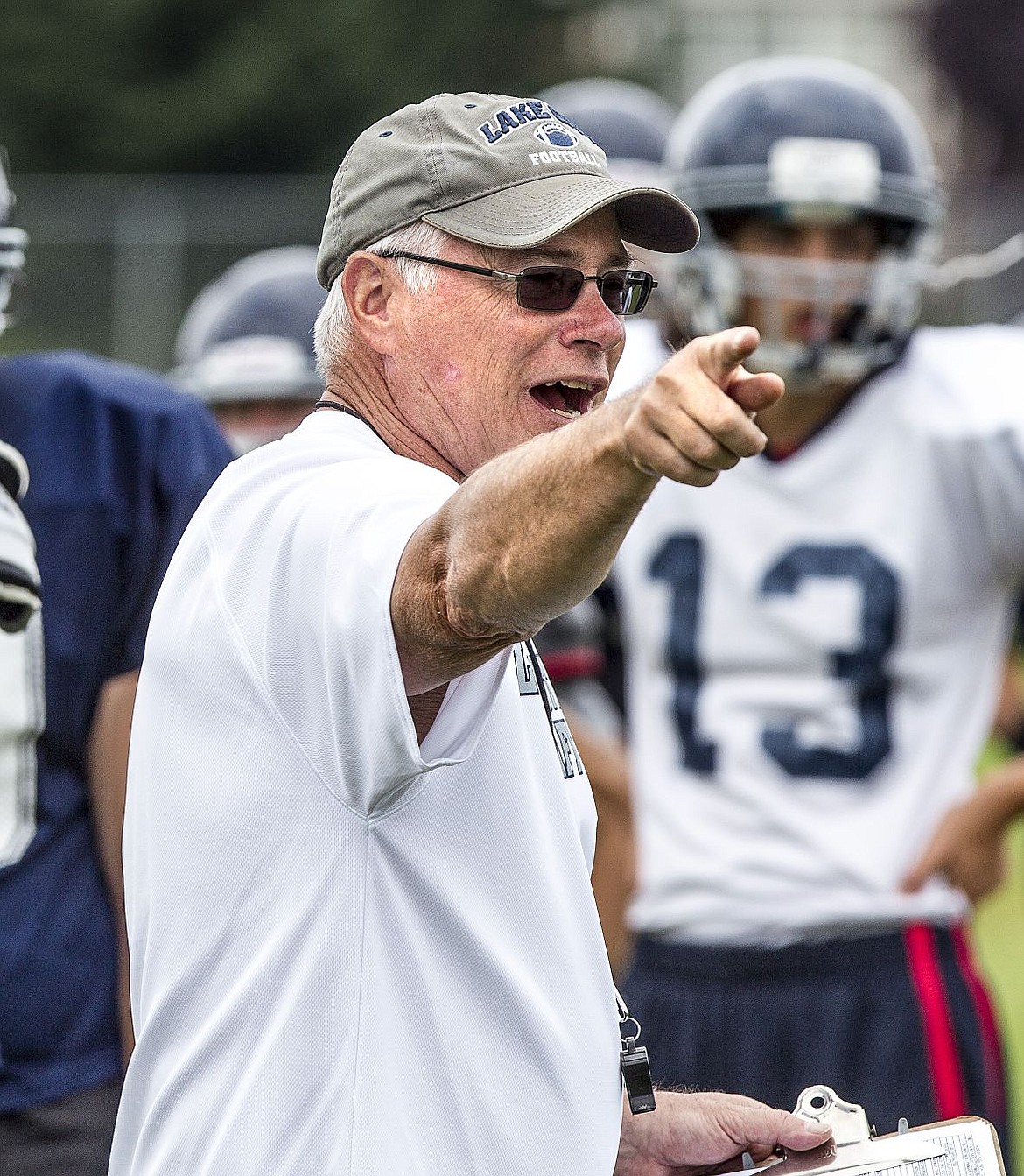 &lt;p&gt;JAKE PARRISH/Press Lake City High School head football coach Van Troxel directs players during a practice on Thursday, Aug. 14, 2014 at Lake City High School. Troxel has coached football for 40 years, and this season will marked the end to his 20th at Lake City.&lt;/p&gt;