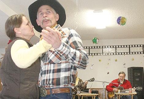 Photo by Aaric Bryan&lt;br&gt;St. Regis' Joanne and Tom Heacock cut up the rug to an old county song played by the Eagle's Nest Assisted Living band at the St. Regis Community New Year's Eve party at the community center.