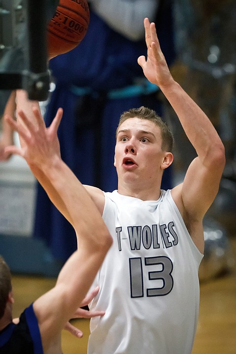 <p>Lake City High's Mark Smyly goes up for a shot on the baseline during the first half of the T-wolves game against Coeur d'Alene.</p>