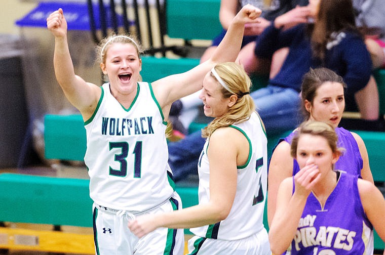 <p>Glacier junior Brielle Bumgarner (31) celebrates after taking a charge Tuesday night during Glacier's home victory over Polson. Jan. 7, 2014 in Kalispell, Montana. (Patrick Cote/Daily Inter Lake)</p>