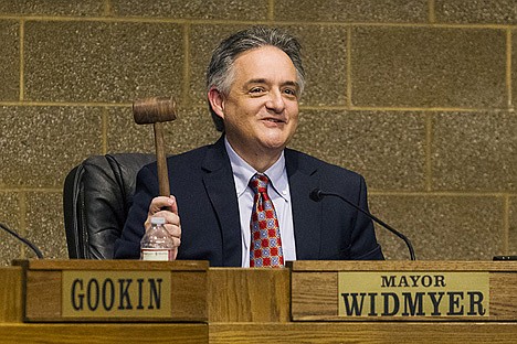 &lt;p&gt;Mayor Steve Widmyer waves a gavel that his father made for him while addressing the public Tuesday during a city council meeting at the Coeur d&#146;Alene Public Library where new council members, including Widmyer, were sworn into office.&lt;/p&gt;