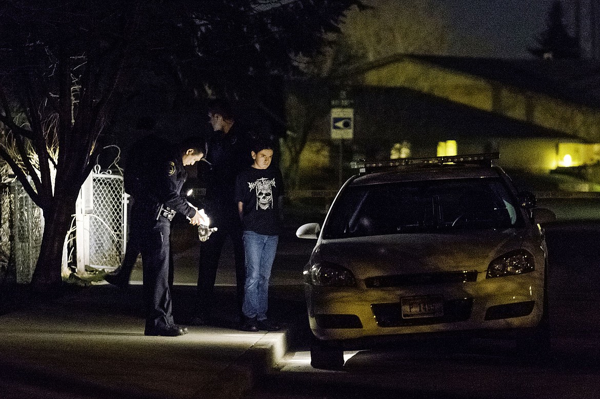 &lt;p&gt;SHAWN GUST/Press&lt;/p&gt;&lt;p&gt;Coeur d'Alene Police prepare 14-year-old Eldon Samuel III for transport to the police department, where he was interviewed and booked Monday, March 24, 2014. The teen was later charged as an adult with two counts of first-degree murder.&lt;/p&gt;