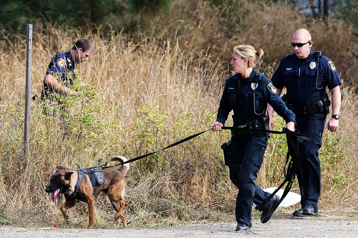 &lt;p&gt;TESS FREEMAN/Press&lt;/p&gt;&lt;p&gt;Coeur d&#146;Alene Police Officer Amy Winstead leads K9 Pecco on a search with other Coeur d&#146;Alene Police Officers for a suspect in an armed robbery on East Nieder Avenue on Saturday, Oct. 4, 2014.&lt;/p&gt;