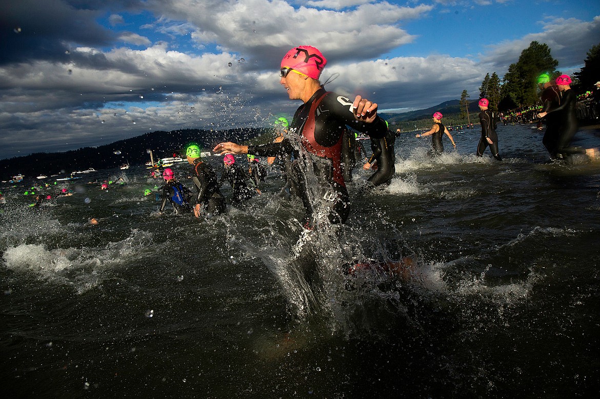 &lt;p&gt;TESS FREEMAN/Press&lt;/p&gt;&lt;p&gt;Tracy Bitton runs into Lake Coeur d&#146;Alene with other athletes during the Age Group Swim Start for Ironman Coeur d&#146;Alene on Sunday, June 29, 2014.&lt;/p&gt;