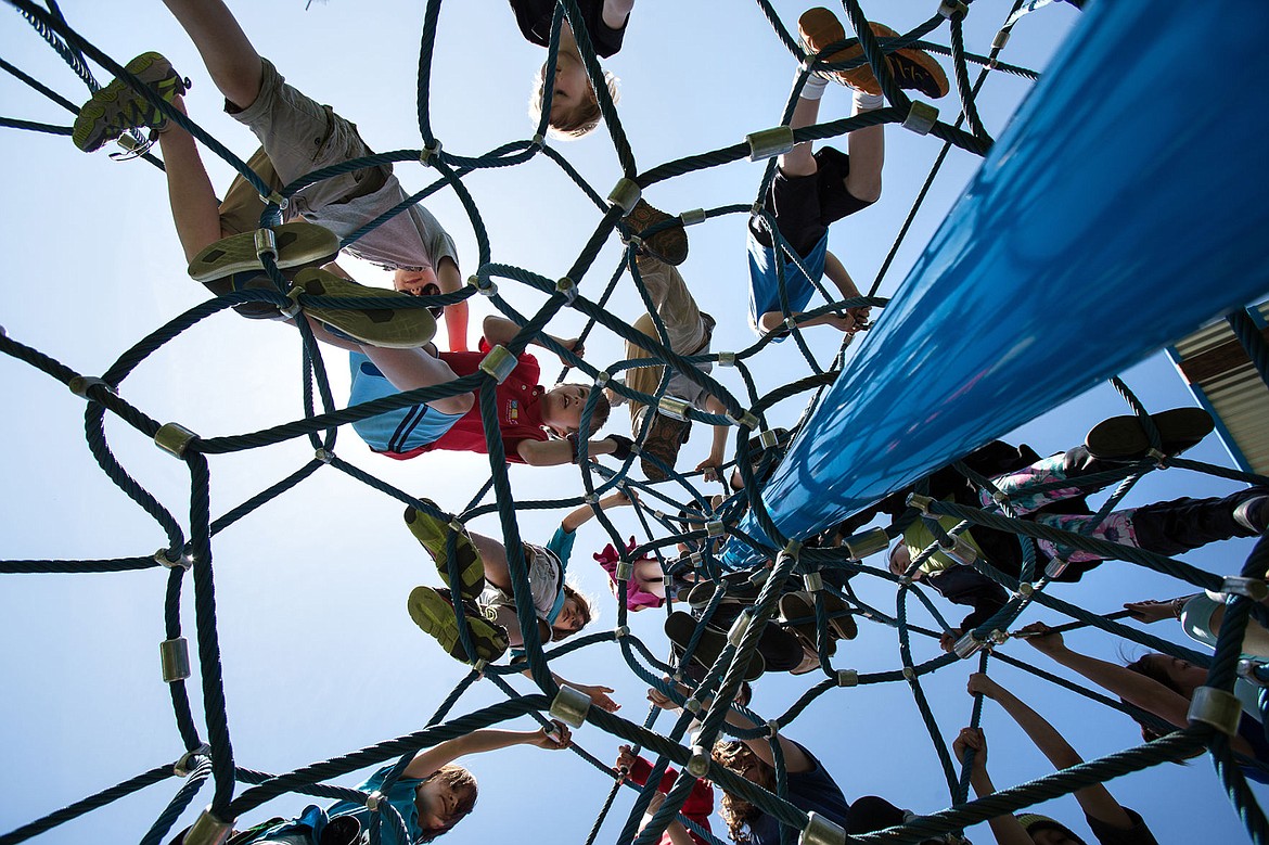 &lt;p&gt;GABE GREEN/Press&lt;/p&gt;&lt;p&gt;A swarm of Sorensen Magnet School students crawl up a webbed play structure at McEuen Park Friday, May 2, 2014 during a school field trip.&lt;/p&gt;