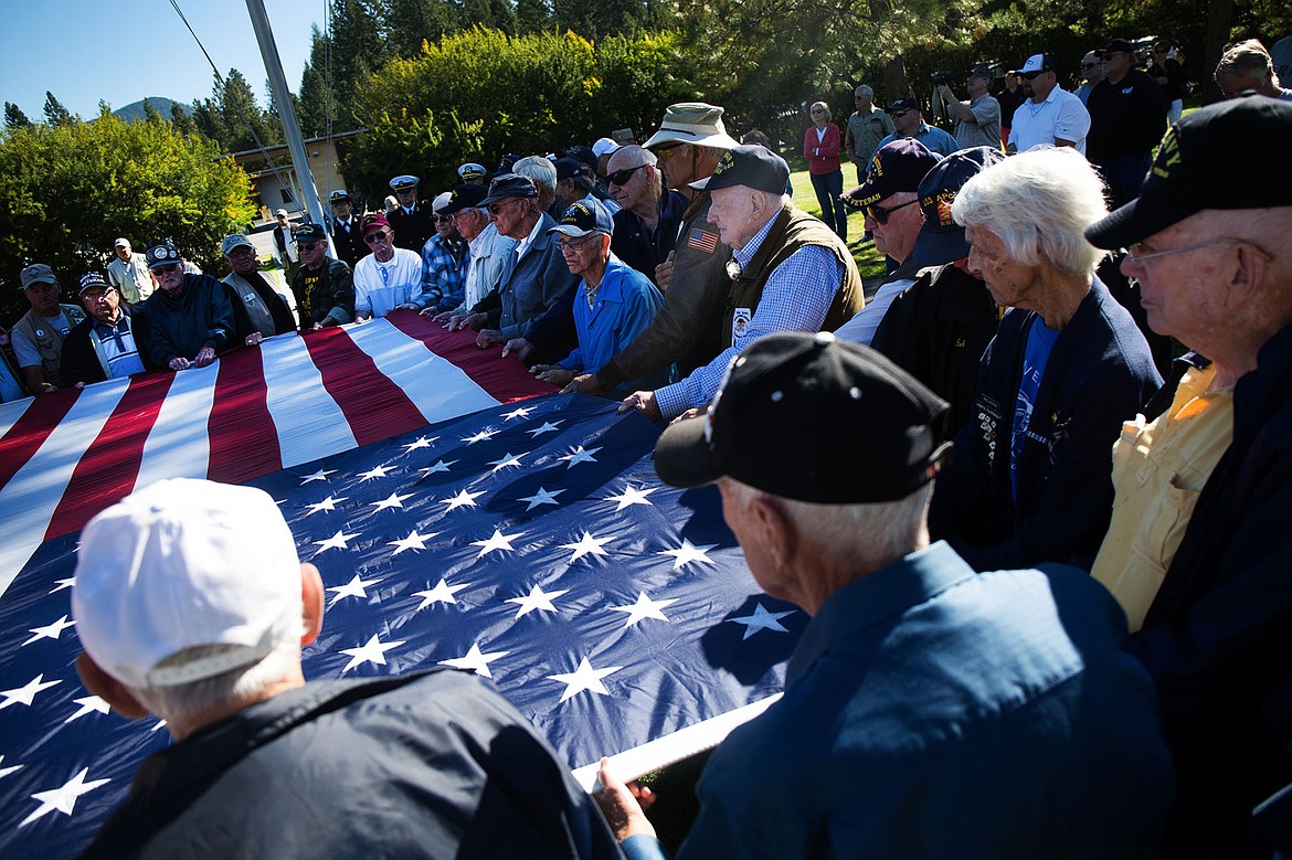 &lt;p&gt;TESS FREEMAN/Press&lt;/p&gt;&lt;p&gt;Dozens of Veterans who trained at the Farragut Naval Training Station from 1942-1946 gather to sing &#147;God Bless America&#148; to close the opening ceremony for the 28th annual Farragut Veterans Reunion at Farragut State Park on Saturday, Sept. 6, 2014.&lt;/p&gt;