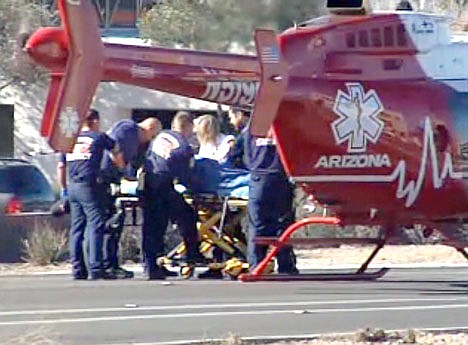 &lt;p&gt;Emergency personnel use a stretcher to carry a shooting victim to a helicopter outside a shopping center in Tucson, Ariz. on Saturday where U.S. Rep. Gabrielle Giffords, D-Ariz., and others were shot as the congresswoman was meeting with constituents.&lt;/p&gt;