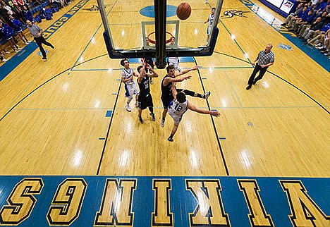 &lt;p&gt;Coeur d&#146;Alene High School&#146;s Colby Daniels (12) puts a two-point shot as he is fouled by Lake City&#146;s Michael Goggin during the fourth quarter Thursday in Coeur d&#146;Alene.&lt;/p&gt;