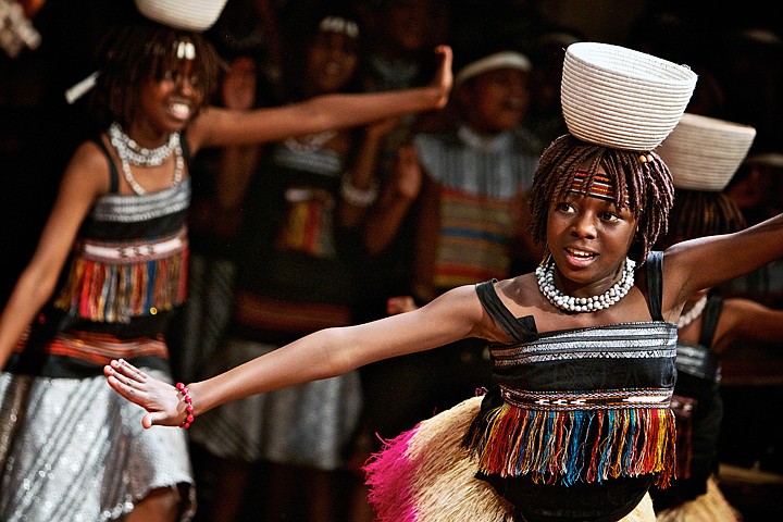 &lt;p&gt;JEROME A. POLLOS/Press A member of the Asante children's choir performs on stage Monday with her group at Sorensen Magnet School of the Arts and Humanities.&lt;/p&gt;