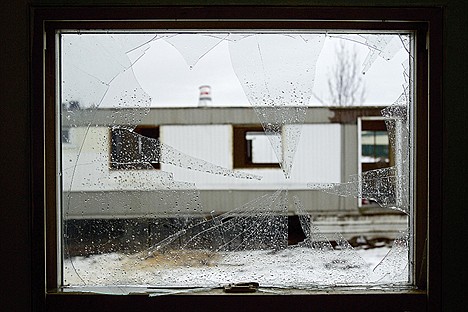 &lt;p&gt;A broken window provides a view of one of the mobile homes that await demolition as the property owner of the former El Rancho Mobile Home Park in Post Falls prepares the land for development.&lt;/p&gt;