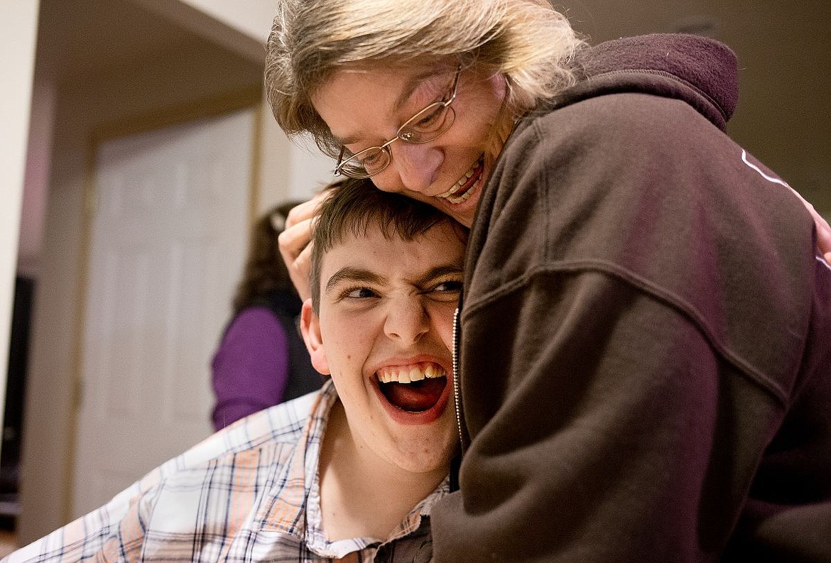 &lt;p&gt;Cody Gray, 23, who has autism, shares a moment with Laurie West, a caregiver for the nonprofit Milestone Decisions, on Wednesday at Cody's home in Coeur d'Alene. West assists Cody and his two roommates and works with her own son, who is also mentally disabled but lives in another home. The Idaho Department of Health and Welfare recently announced that Medicaid reimbursement rates funding supportive living and residential habilitation provider agencies, such as Milestone Decisions, would be significantly decreased and revert to 2012 rates as of Feb. 1, 2016.&lt;/p&gt;