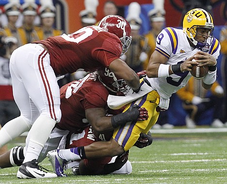 &lt;p&gt;LSU's Jordan Jefferson (9) is stopped by Alabama's Dont'a Hightower (30), Damion Square (92) and Courtney Upshaw (41) during the first half of the BCS National Championship college football game Monday, Jan. 9, 2012, in New Orleans. (AP Photo/Gerald Herbert)&lt;/p&gt;