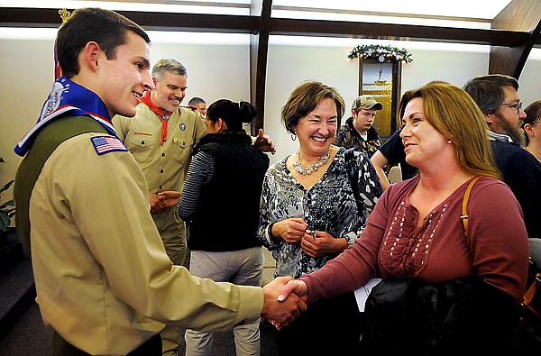 &lt;p&gt;Michael Reimer is greeted by friends and family following his
Eagle Scout ceremony.&lt;/p&gt;